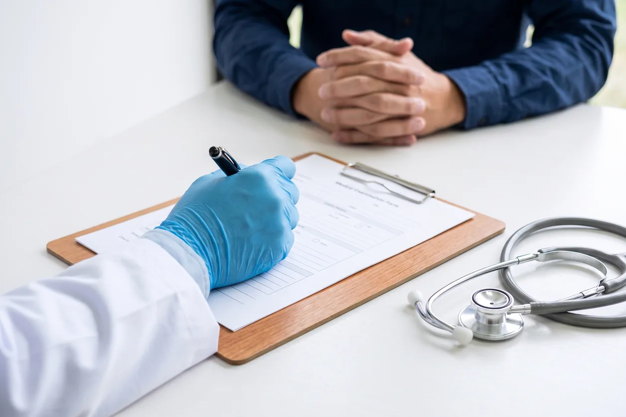 DOT physical exam form on a clipboard