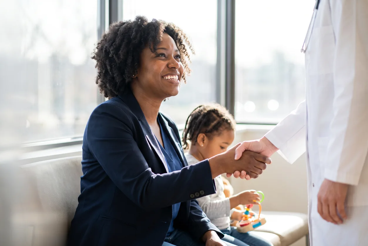 Family medicine doctor greeting a patient